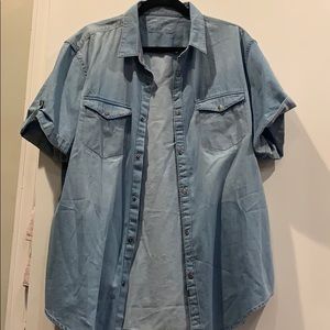 Denim shirt with snap buttons.